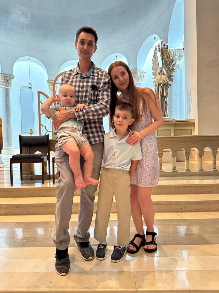 Alex Kukota with his wife and their two sons